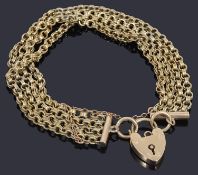 A gold four row belcher link chain bracelet with padlock