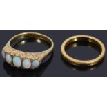 An opal set five stone half hoop ring and a wedding ring