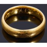 A 22ct gold court shaped wedding ring