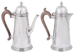 An Elizabeth II George I style silver coffee pot and matching hot water jug