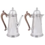 An Elizabeth II George I style silver coffee pot and matching hot water jug