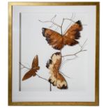 A contemporary wooden picture of three butterflies on a branch