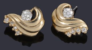 A pair of gold diamond stud/spray earrings