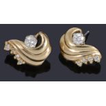 A pair of gold diamond stud/spray earrings