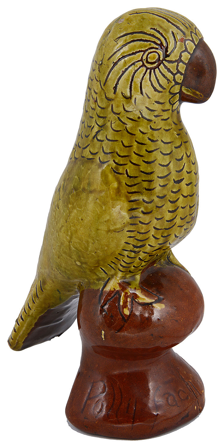 A Welsh Ewenny pottery glazed earthenware figure of a parrot