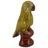 A Welsh Ewenny pottery glazed earthenware figure of a parrot