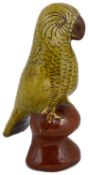 A Welsh Ewenny pottery glazed earthenware figure of a parrot