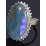 A black opal triplet and diamond cluster ring