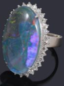 A black opal triplet and diamond cluster ring