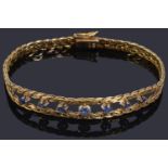 A gold sapphire chain bracelet