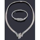 A charming Continental white gold diamond necklace with matching bracelet,