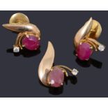 A pair of attractive gold ruby and diamond spray earrings and a matching pendant