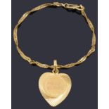 A high carat gold twisted curb link bracelet with a high carat gold heart shaped pendant