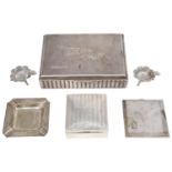 An Art Deco silver table cigarette box; others