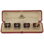 A set of four George V silver and tortoiseshell menu card holders