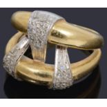 A gold two row diamond set band ring