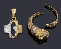 A gold diamond set cross pendant and a gold leopards head ring