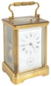 A 20th century French repeating brass alarm carriage clock