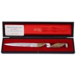 A Stuart Devlin silver and parcel gilt paper knife