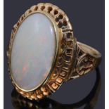 A gold single stone opal cabochon ring