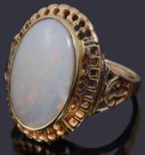 A gold single stone opal cabochon ring