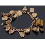 A 9ct gold charm bracelet with padlock and assorted gold charms