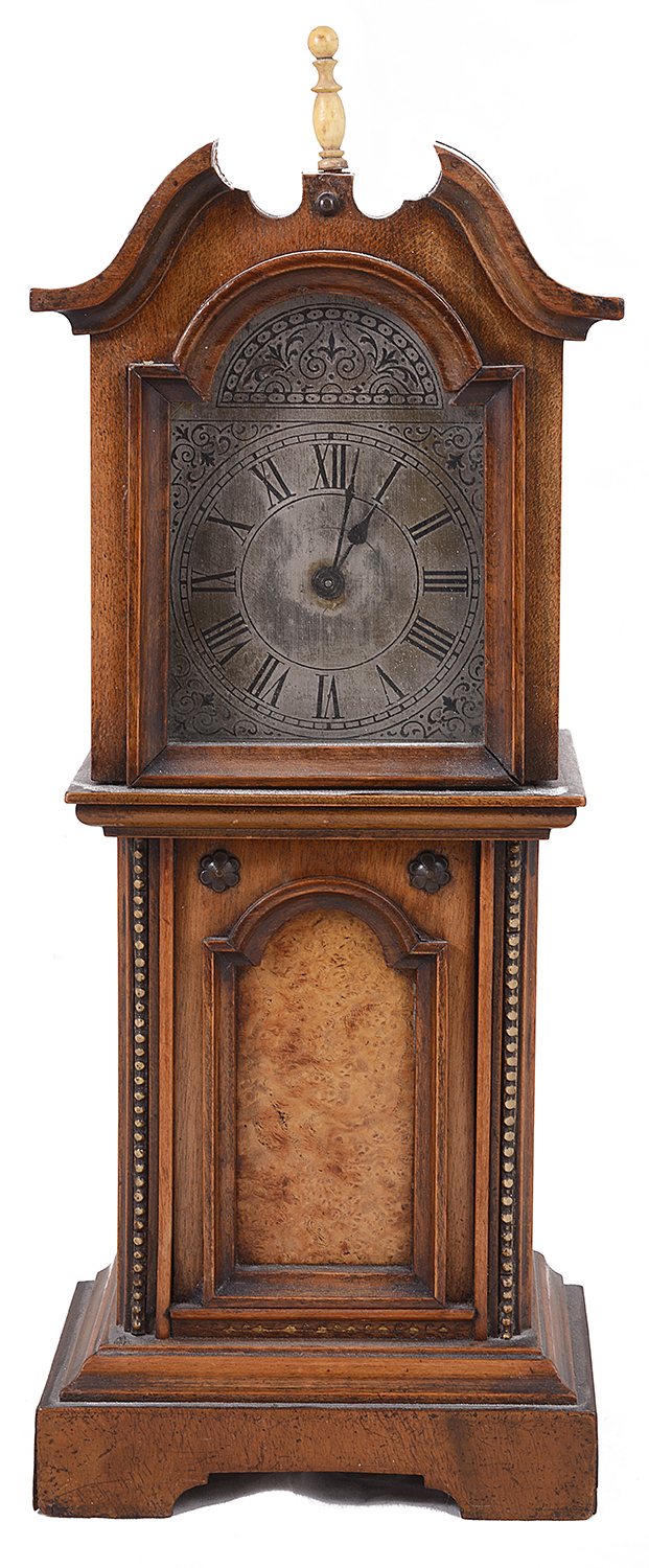 A late 19th century continental walnut miniature longcase mantle clock