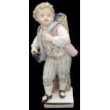 A small 19th century Meissen porcelain figure of vintner