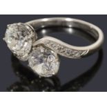 An attractive two stone diamond crossover 'toi et moi' ring