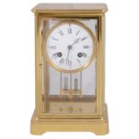 A late 19th century French gilt brass four glass mantel clock