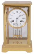 A late 19th century French gilt brass four glass mantel clock