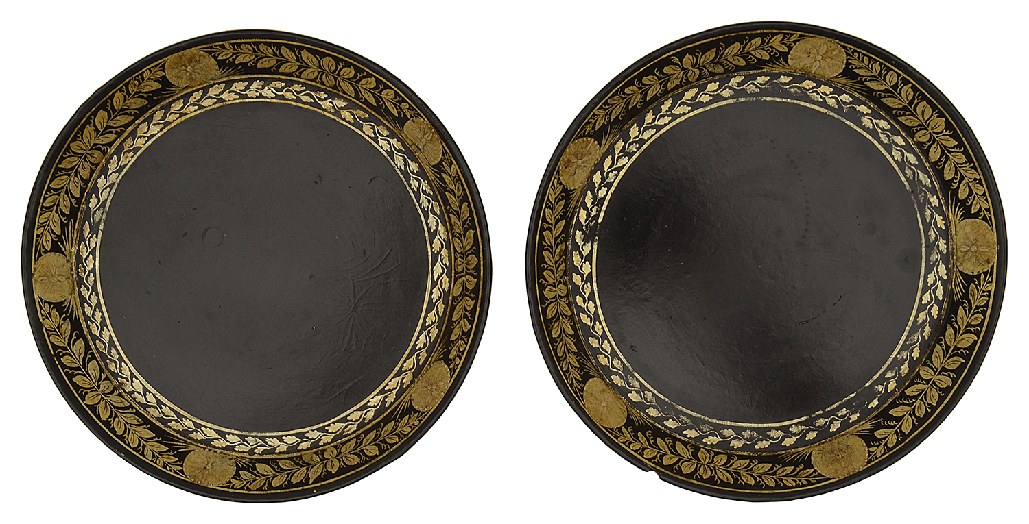 A pair of George III black japanned and gilt decorated papier mache bottle coasters c.1800