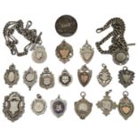 Two Victorian silver watch chains and a collection of silver fobs