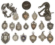 Two Victorian silver watch chains and a collection of silver fobs