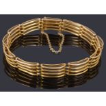 A gold four row gate link bracelet