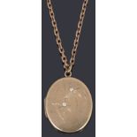 A 9ct gold oval hinged locket on chain