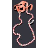 A Chanel pink bead and simulated pearl necklace