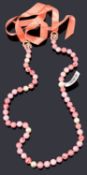 A Chanel pink bead and simulated pearl necklace