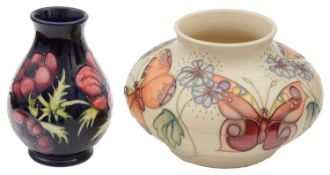 A modern Moorcroft pottery 'Butterfly' pattern vase by Rachel Bishop and an 'Anemone' pattern vase