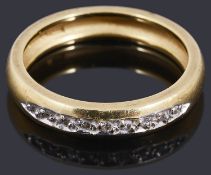 An 18ct gold diamond half eternity ring