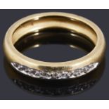 An 18ct gold diamond half eternity ring
