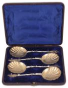 A set of four Victorian parcel-gilt silver apostle fruit serving spoons