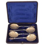 A set of four Victorian parcel-gilt silver apostle fruit serving spoons