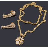 An Indian high carat gold pendant on chain and similar earrings