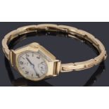 A ladies 9ct gold Tudor mechanical bracelet watch