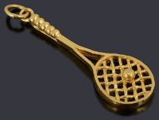 A Chinese high carat gold tennis racquet charm