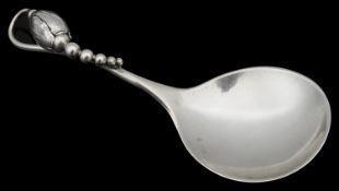 A Danish Sterling silver caddy or jam spoon by Georg Jensen in the blossom pattern