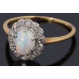 A delicate Edwardian gold opal and diamond cluster ring