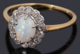 A delicate Edwardian gold opal and diamond cluster ring