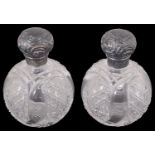 A pair of late Victorian silver mounted scent bottles